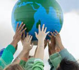 picture of a globe being held up by young people with their hands meeting together