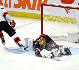 Ottawa Senators goalie Joonas Korpisalo stretches to make a save vs. NJ Devils, Dec. 29, 2023 