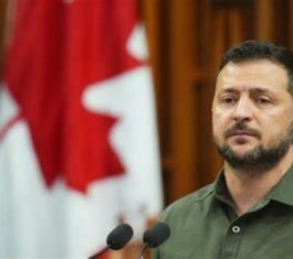 Ukrainian President Volodymyr Zelenskyy in front of a microphone in Canada's Parliament