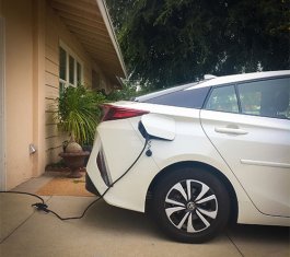 EV plugged into a home electrical outlet