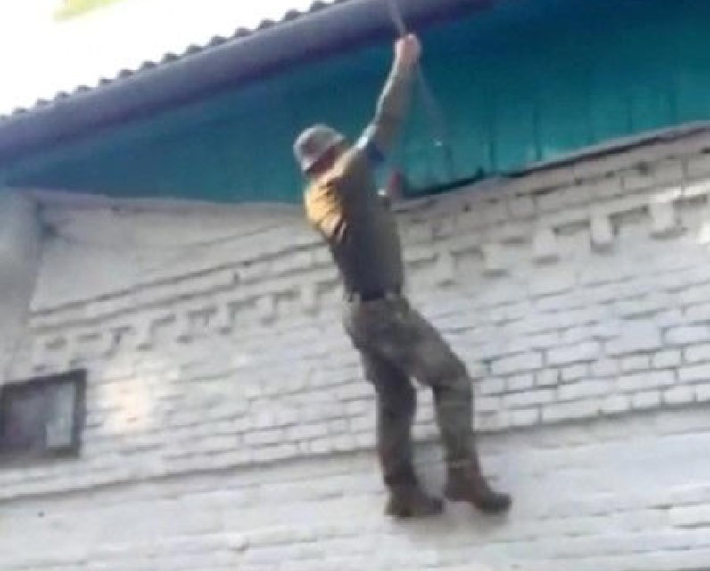 Ukrainian soldiers raise their flag in Kursk Oblast, Russia. 